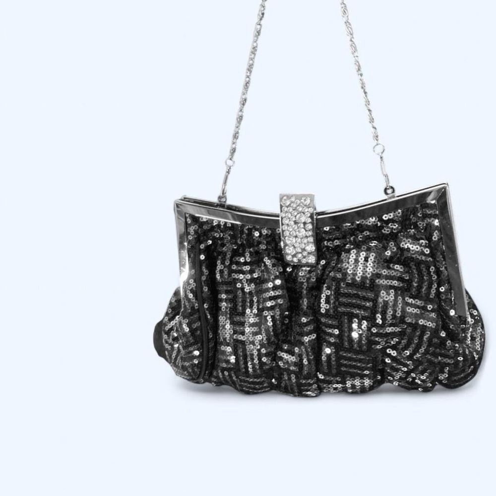 Black sequin clutch with silver chain strap and rhinestone clasp